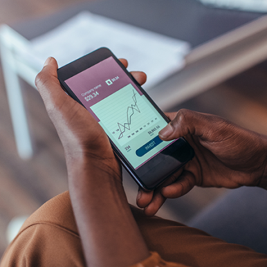 A woman checking her bank account on her smartphone